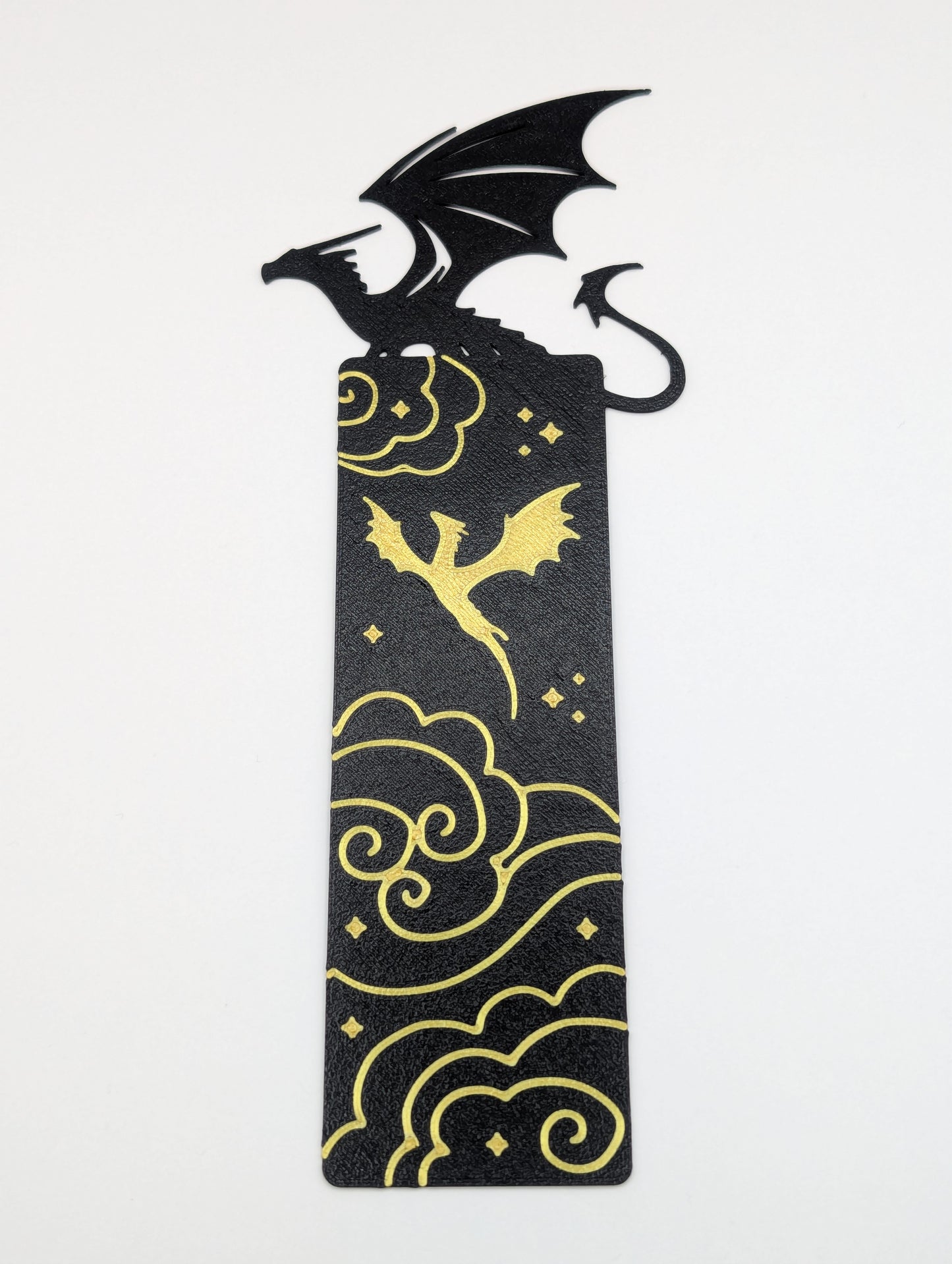 Black Dragon sitting and Gold Dragon flying with stars and clouds bookmark