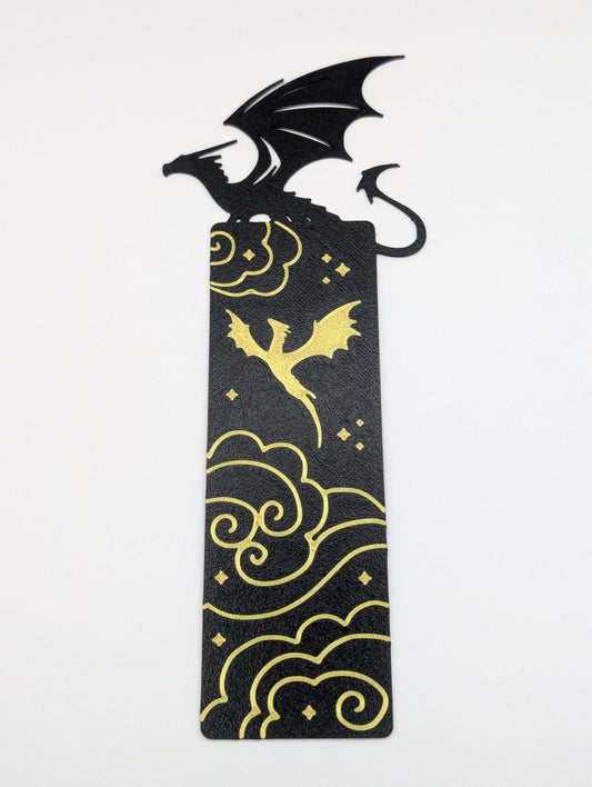 Black Dragon sitting and Gold Dragon flying with stars and clouds bookmark